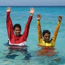 happy lifeguards swim in anoraks